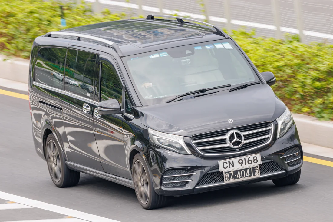 Black Mercedes-Benz V-Class premium MPV photographed from the front and side.